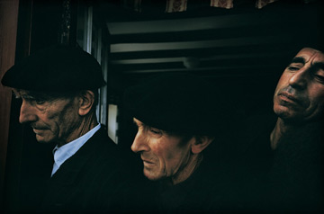 Three men listening to a poet, France by William Albert Allard at Les Yeux du Monde Art Gallery